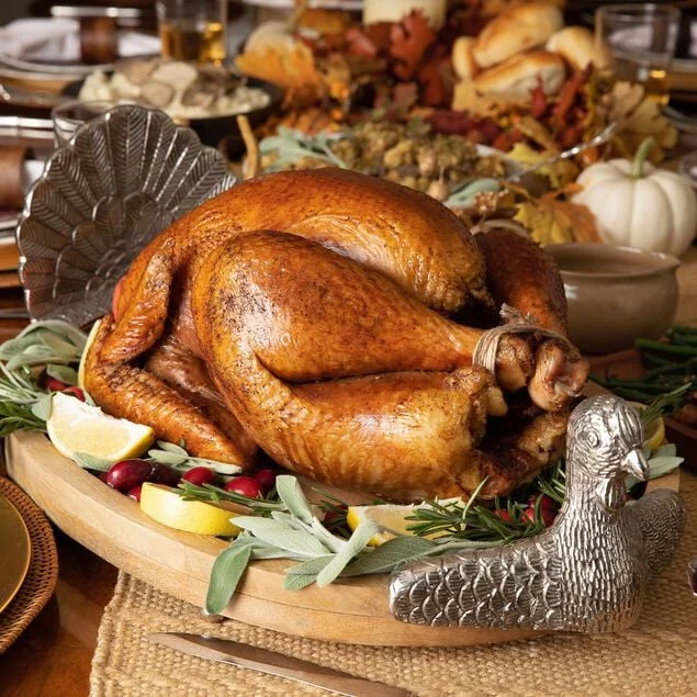 Whole turkey roasted golden brown with herbs and lemon; serving inspiration