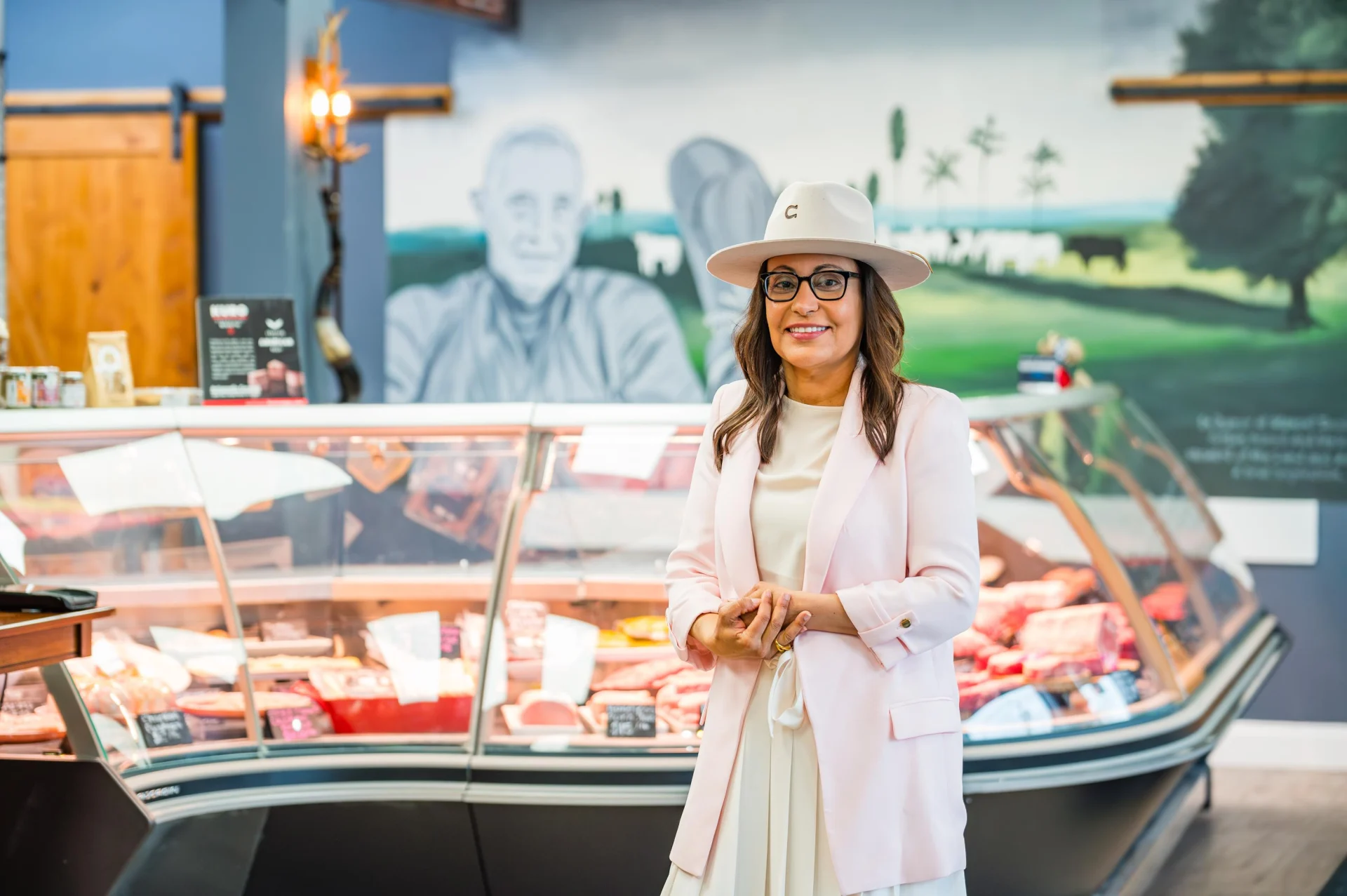 Rosangela Teodoro welcoming customers at Teodora’s butcher counter